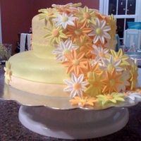 Daisy Bridal Shower Cake So after finishing this cake my Husband asked me if it was supposed to look like a hat! It wasn't, but oh well! Covered in fondant...