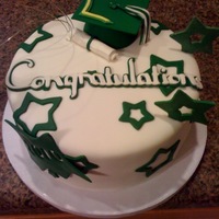 Green And White Graduation Fun little graduation cake. All elements are fondant except for the lettering, which was cut using Cricut Cake.