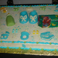 Baby Item Cake full sheet cake with 2-d candies on top