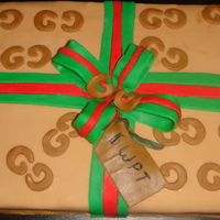 Gucci Gift Cake covered in fondant and cut out the letters by hand.... my 1st time.