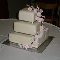 Cherry Blossom Wedding Cake My 1st Wedding Cake - VERY STRESSFUL!! Chocolate and Vanilla cake covered with fondant and gumpaste flowers. The Bride was very please with...