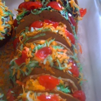 Taco Cupcakes The shell is melted yellow chocolate wafers with a little cocoa powder added. A slice of cupcake in the middle, covered with chocolate...