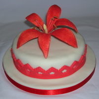 Red Lily Handmade red lily on top of a coconut cake