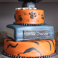 Grad Cake This was for a college graduation all done in fondant for a friend of mine! His school mascot was a tiger...