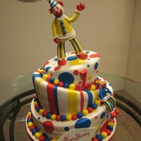 Clown Cake Topsy turvy clown themed cake, pound cake with vanilla buttercream and filled with fresh strawberries. Clowns made from fondant with a lil...