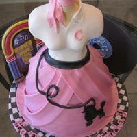Fifties Cake This is a cake i designed for a 50's party. the whole thing is made with fondant. the body was molded from RKT and modeling chocolate...