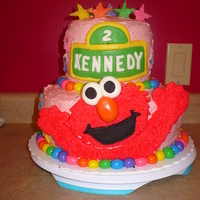 Daughter's 2Nd Birthday Cake Chocolate cake with Strawberry Buttercream and Chocolate Ganache filling. Elmo, balls and stars are all homemade MMF. Stars are covered...