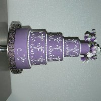 Purple Sweat Peas On Fondant 2",4",6",8" and 10" covered in a purple fondant. My gumpaste Sweat Peas and the royal icing scrolls are by my...