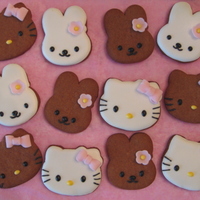 Hello Kitty And Cathy Hello Kitty and Cathy gingerbread cookies with royal icing. Bows and flowers are gumpaste.