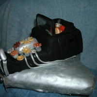 Steampunk Flying Model T This is a chocolate cake with vanilla buttercream covered in fondant. The engine parts are all made of fondant painted with silver and gold...