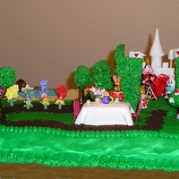 Tour Of Wonderland This cake is made to represent the Disney Wonderland. There is the door to wonderland, the ocean and beach, forest, singing flower's...