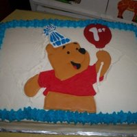 1St Birthday This was my first half sheet cake! Wow what an experience lol It was a white cake with BC filling. Pooh was made with RI ... before I read...