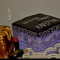 Greek Key Birthday Cake Vanilla cake filled with raspberry mousse and covered with fondant and airbrushed. Lipstick, eyeshadow and pearl necklace made with mix GP...