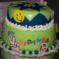 70's Theme Birthday Cake This cake was so fun to do. The top is dark chocolate with raspberry filling and the bottom is a multicolor vanilla with buttercream...