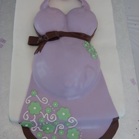 Preggo Belly Cake This was my first pregnant belly cake! I used fondant and a MNM candy for the baby foot and belly button.