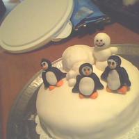 First Cake fondant covered, and fondant figurines. this is my first attempt at decorating the cake. There are some fondant mistakes on the sides, but...