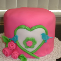 Birds In Bloom Inspired by a onesie I saw. Caramel cake with vanilla buttercream. First pink cake, so I had SO much fun making this one.