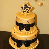 Golden Cake made this for a friend's Christmas party at work. They requested the cake to be Gold with black accents to go with their motif and &...