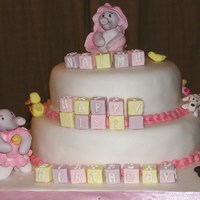 Baby Elephants And Nursery Toys 2 tier sponge. Models made from sugarpaste with cmc.