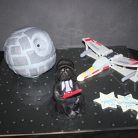 Star Wars Inspired Birthday Cake The death star was made out of white choc mud - but unfortunately one side collapsed at the last minute - so the shape was a little off....