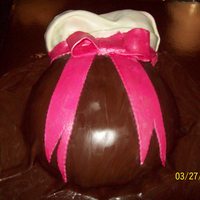 Baby Belly Cake Ok, another first attempt here and this time it is a baby belly cake. Simple yellow cake, white buttercream, chocolate fondant dress, white...