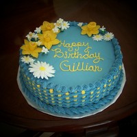 Daffodil Birthday Cake 12 inch round, buttercream icing, basketweave, flowers made out of fondant/gumpaste.
