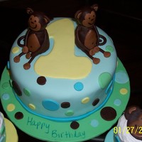 Twins First Birthday Chocolate cake with buttercream and marshmallow fondant. The monkeys are my first attempt with modeling chocolate.