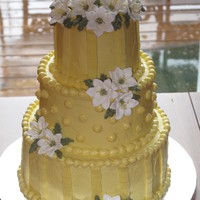 Lilies For My Mom This was my first tiered cake I made Dec 09 for my moms birthday I was taking the Wilton 3 class at the time and had just learned to make...