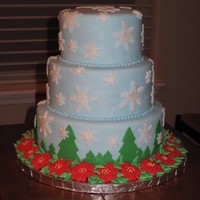 Snowflakes For Christmas This was my final cake for my Wilton 3 class. Learned to make the royal icing poinsettias and tiered cake in the class. 10, 8, 6 inch cakes...