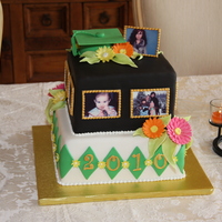 Anna's Graduation Cake This cake was for my nieces graduation party. Her school colors are black, green and white and I wanted to add a little color with the...