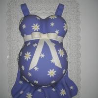 My First Belly Cake This was my first belly cake for a surprise baby shower. Since we didn't know the sex of the baby I chose a neutral colour.Belly is a...