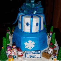 My Nephew's B-Day/christmas Cake This is only my 2nd cake I've made. All figures and bow/ribbons are made of gumpaste, cake covered in MM Fondant with royal icing...