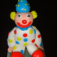 Clown Made of gumpaste w/fondant hair and dots.