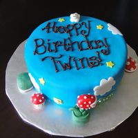 Mario Bros. Theme A single tier,double layer cake covered in fondant and airbrushed blue. Fondant stars, ? blocks, Piranha plant, clouds, turtles and...