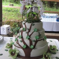 Tree Branch Wedding Cake Surrounded By Orchid 