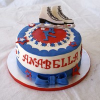 Ice Skater 10" vanilla butter cake with cookies and cream filling. Sugarshack buttercream and fondant decorations. The skates were made of...