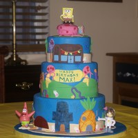 Spongebob Squarepants 6" 8" and 10" vanilla butter cakes with cookies and cream filling. Covered in fondant with fondant decorations. The figures...