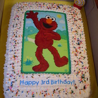 Elmo Birthday Cake Red Velvet cake, cream cheese icing, Elmo edibe image that I had to "fix" (see my cake disaster), ice cream sprinkles for color,...