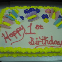 Butterfly First Birthday Butterflies made from gum paste and buttercream. Royal icing flowers