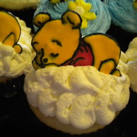 Sleeping Pooh These were for a baby shower for a friend. Cupcake is vanilla filled with raseberry filling, buttercream icing on top to look like a cloud...
