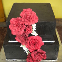 Midnight Romance Black chocolate butter cream cake, gum paste roses, gum paste hydrangea, trimed with rhinestone ribbon.
