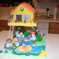 Go Diego Go The house is covered in fondant as well as all the little figures are made of fondant. The bushes were made of pieces of cake and leaves...