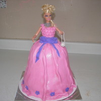 Barbie Doll Cake Used one 8" cake, 2-6" cakes and one basketball cakes to form the skirt. Used a lot of buttercream frosting to shape the skirt...