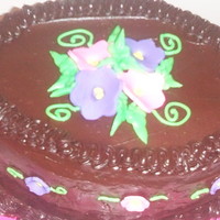 For Chocolate Lovers Standard devil foods chocolate cake and icing with fondant flowers
