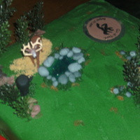 Laying In Wait This cake was for my brother. I made it for his groom's cake. The only thing I did not make were the trees, and the deer, everything...