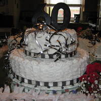 60Th Birthday Cake Yellow cakes and all different shaped pans and my own frosting techniques. Black, silver and white theme with fresh roses.
