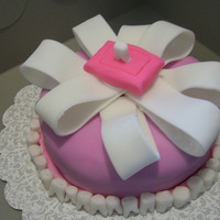 Dentist Cake! Chocolate cake, covered in fondant and the little teeth, ribbon and pillow are made out of fondant too! I LOVE the teeth!