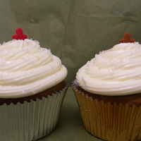 Gingerbread Cupcakes Gingerbread cupcakes with cream cheese frosting, a little mini gingerbread man on the top and white crystal sugar!