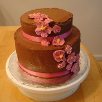 30Th Birthday 2 tiered cake I made for my sisters 30th. Mocha Frosting and pink royal icing flowers. The pink satin ribbon started to soak up some o the...