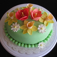 Floral Birthday Cake I made this cake for my co-worker's birthday. This was my first time making daffodils and tulips.